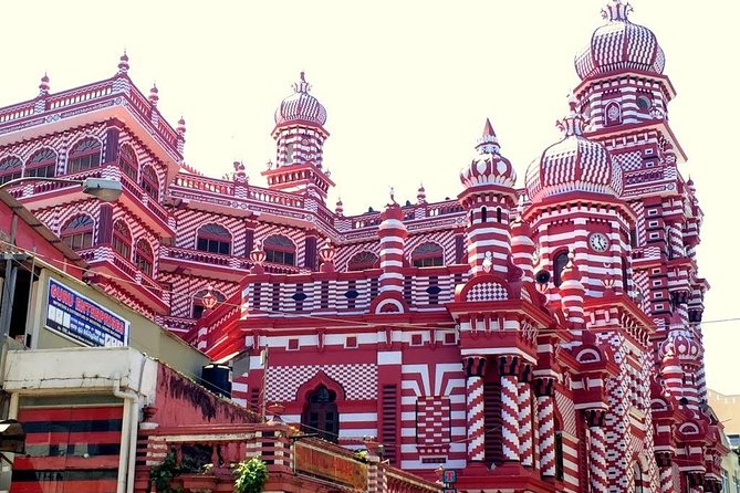 Colombo City Sightseeing - Jami Ul-Alfar Mosque’s red and white design