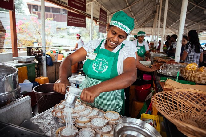 The 10 Tastings of Kandy With Locals: Private Street Food Tour - Kandy Lake provides a scenic pause